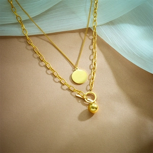 Double-layered gold titanium steel necklace with circular pendants and toggle clasp