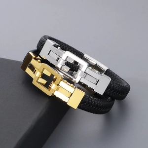 Detailed close-up of woven leather bracelets with gold and silver stainless steel buckles