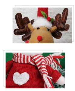 Detail of Christmas reindeer plush featuring red knit sweater and leather texture antlers