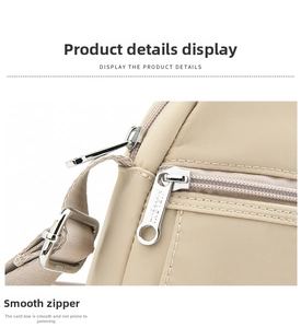 Detailed close-up of premium silver zipper and nylon fabric on the khaki crossbody bag