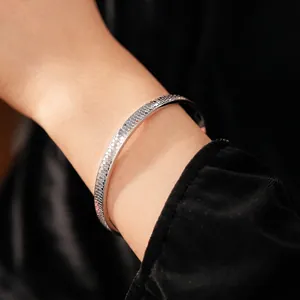 Polished silver textured open bangle with a luxury minimalist geometric pattern