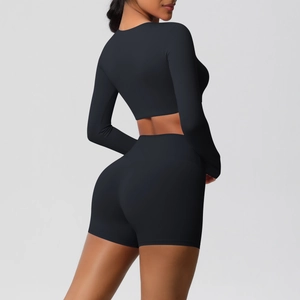 Rear view of sleek black high-waist fitness shorts highlighting seamless lifting effect