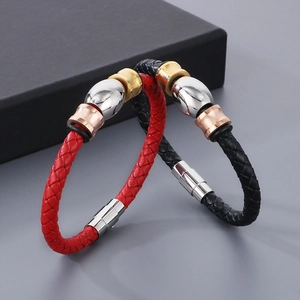 Detail of woven leather bracelets in red and black with stainless steel magnetic clasps