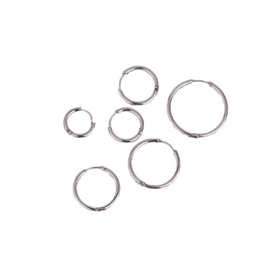 Polished silver stainless steel hoop earrings in various sizes on a white background