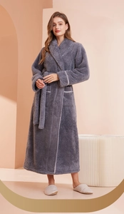 Detail of soft charcoal grey thick fleece bathrobe showing classic shawl collar and white piping