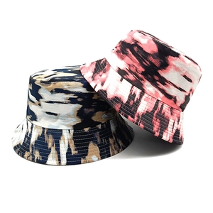 Abstract tie-dye graffiti bucket hats for couples in blue and red artistic canvas fabric