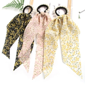 Floral print hair scrunchies with pearls and long ribbon streamers in three colors