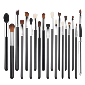 Detailed close-up of 20 professional eye and face makeup brushes with black handles