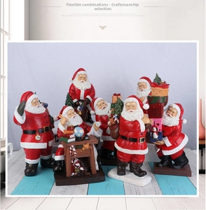 Detailed view of various resin Santa Claus figurines with festive Christmas gift accessories
