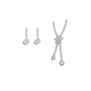 Sparkling silver diamond heart necklace and teardrop earrings set on white background