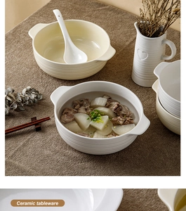 Ceramic soup bowls with handles and lids shown in a warm, cozy dining setting