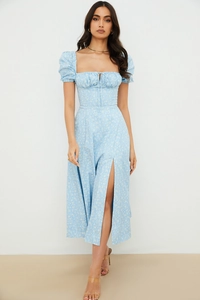 Detail showing square neck with drawstring and puff sleeves on floral maxi dress