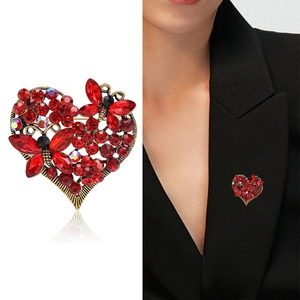Vintage heart brooch with red rhinestones and butterflies on a black suit lapel
