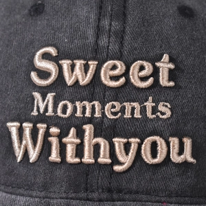 Macro shot of Sweet Moments Withyou high-density embroidery on washed cotton baseball cap