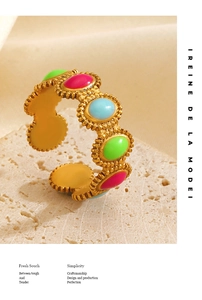 Detail of gold-plated adjustable ring with pink green and blue enamel oval stones