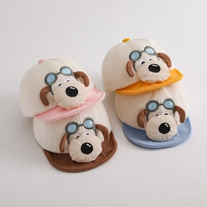 Detailed flat lay of children's corduroy baseball caps with 3D cartoon puppy embroidery