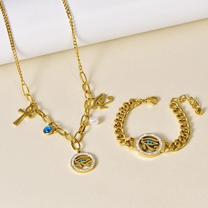 Golden jewelry set featuring chunky chain necklace and bracelet with blue evil eye charms