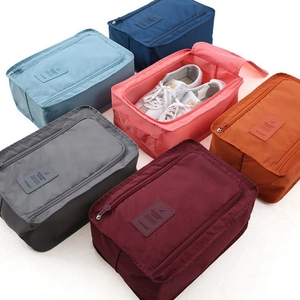 Waterproof nylon travel shoe storage bag available in six vibrant colors with handle