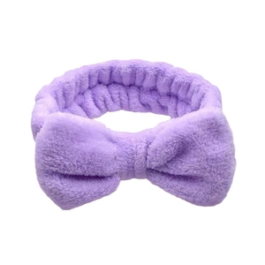 Detail of plush lavender coral fleece headband with soft bow for washing face
