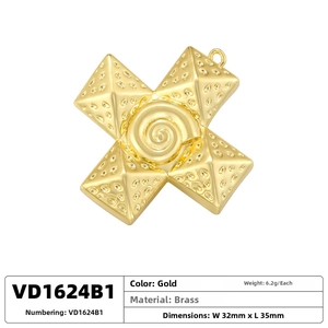 Detailed view of vintage brass hip hop cross pendant with spiral textures and pyramid studs