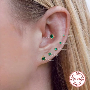 Detailed comparison of six sizes of green S925 sterling silver stud earrings on ear