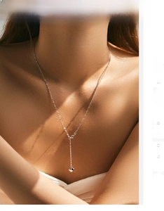 Detailed close-up of a S925 sterling silver Y-shaped necklace with a polished heart pendant