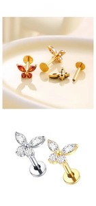 Detailed view of titanium butterfly labret studs with colorful cubic zirconia stones