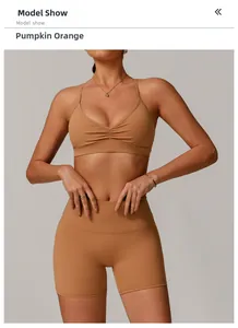 Detail of pumpkin orange sports bra with center ruching and high waist fitness shorts
