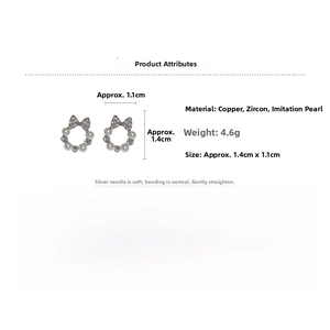 Detail view of bow zircon earrings with imitation pearls and S925 silver pins