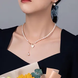 Elegant natural freshwater pearl necklace and earring set with heart shell pendant
