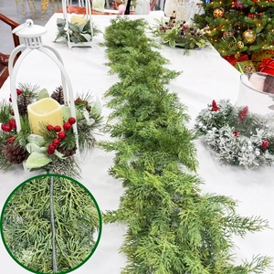 Close-up of artificial cedar garland with flexible wire core for Christmas table decor