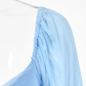Close-up of light blue mesh fabric with elegant ruched details on the shoulder seam