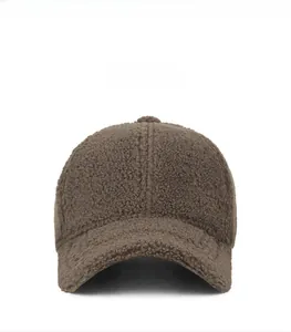 Detailed view of dark brown sherpa fleece texture on a warm winter baseball cap