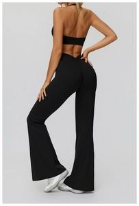 Detail of high-waisted flared yoga pants with V-shaped waistband and ruched booty lifting effect