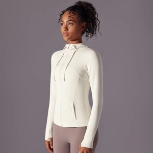 Detailed view of women's hooded sports jacket featuring practical thumbhole cuffs