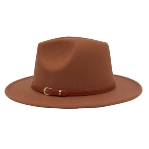 Close-up of caramel brown wool fedora hat featuring a leather band with gold metal buckle