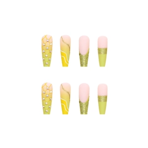 Long ballet press-on nails with yellow gradient, glitter, and rhinestone daisy accents