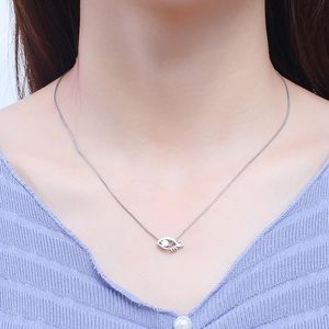 Silver eye pendant necklace with pearl detail on a sleek snake chain for women