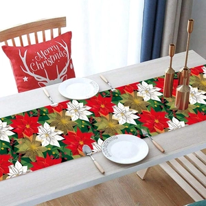 Christmas table runner with festive red and gold poinsettia floral patterns for holiday decor