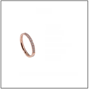 Macro shot of 2mm rose gold titanium ring detailing ten inlaid crystals and dimensions
