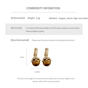 Detailed view of gold plated tiger eye earrings with cubic zirconia and size dimensions
