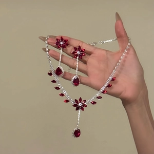 Elegant floral waterdrop jewelry set with red zircon stones featuring necklace and earrings