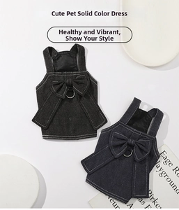 Detail of denim dog dress featuring a large back bow and metal D-ring for leash attachment