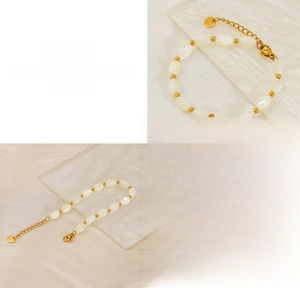 Detailed macro view of baroque pearl bracelet with gold beads and titanium steel clasp