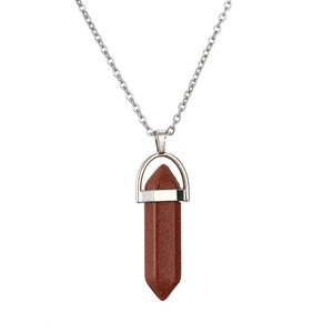 Macro detail of hexagonal red sandstone crystal pendant with silver link chain