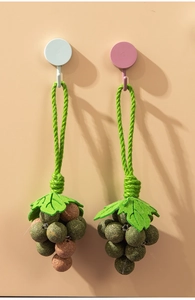Detail view of grape-shaped catnip toy with natural herbs and hemp rope for teeth cleaning