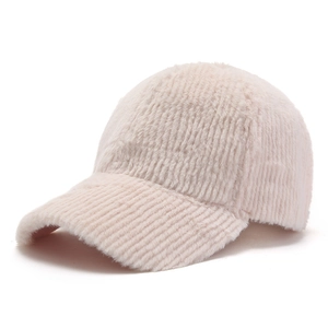 Close-up of pink faux cashmere baseball cap showing soft vertical ribbed texture and fur