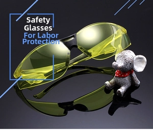 Detail of yellow PC lenses with ANSI Z87.1 safety marking and black streamlined frame
