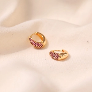 Macro shot of 18K gold plated brass hoop earrings with micro-set purple zircon stones