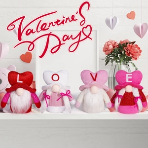 Detailed view of four Valentine Gnomes with LOVE letters on a white decorative shelf